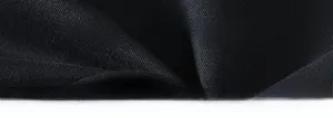 Detailed close-up of premium black fabric texture and smooth drape of long sleeve shirt