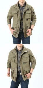 Detail of army green military style jacket with four large cargo pockets and D-ring