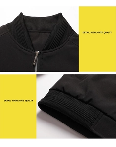 Detail view of black bomber jacket with ribbed collar, cuffs and silver metal zipper