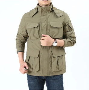 Detail of army green tactical jacket featuring functional multi-pocket system and windproof collar