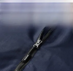 Close-up detail of smooth zipper on dark blue outdoor jacket with SPORTS logo puller