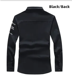 Detail view of black long-sleeve shirt back with white typography print on sleeve
