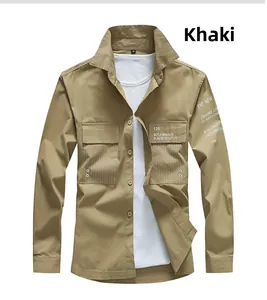 Detail of khaki long-sleeved work shirt featuring chest pocket stripe and sleeve typography