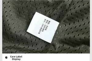 Detailed macro shot of the green jacket mesh lining and fabric composition label