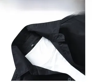 Close-up of black business casual shirt collar with M size tag and inner white tee