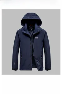 Detail of navy blue windproof jacket with hooded design and letter embroidery