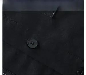 Detail view of black business shirt featuring reinforced stitching and round buttons