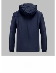 Back view of a navy blue hooded windbreaker jacket with elastic cuffs and matte finish