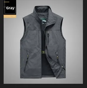 Detail of gray outdoor vest showing metal zippers, multiple pockets, and mesh lining fabric