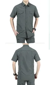 Detail view of dark grey outdoor tactical shirt with functional double pockets and firm fabric