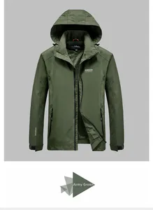 Detail of army green outdoor jacket featuring adjustable velcro cuffs and windproof fabric