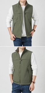 Detail of men's reversible outdoor vest in olive green with fleece collar and zip pockets