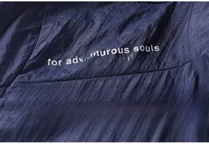 Detailed close-up of dark blue ice silk sun protection jacket with high-quality printing