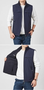 Detail of navy blue reversible fleece vest with inner zip pocket and outdoor logo
