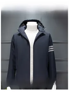 Detailed view of the navy blue windbreaker sleeve showing gray triple stripes and zipper