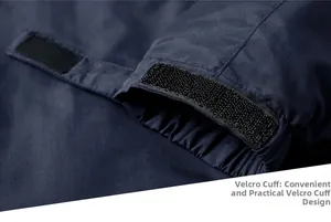 Close-up of adjustable velcro cuffs on navy blue outdoor waterproof jacket sleeve