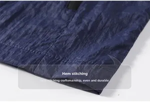 Detail of double-stitched hem on dark blue ice silk sun protection jacket for men