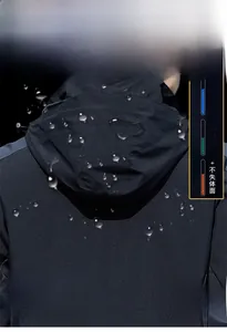 Close-up of waterproof hooded outdoor jacket showing windproof and breathable fabric detail