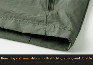 Macro detail of the fishing vest hem showing smooth stitching and durable fabric finish