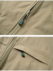 Detail of reversible fleece vest showing metal zippers and chest pockets with sports pulls
