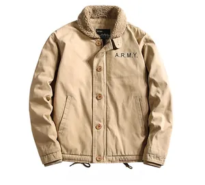Detail of the warm sherpa fleece collar and A.R.M.Y. embroidery on khaki military jacket