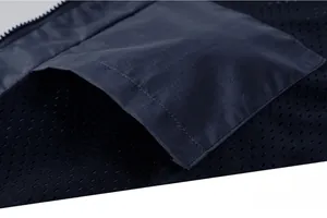 Detail showing breathable mesh lining and secure interior pocket of the outdoor jacket