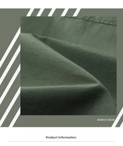 Macro shot of dark green twill fabric showing detailed weave pattern and high texture