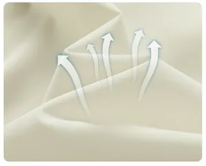 Close-up of off-white breathable fabric showing fine texture and skin-friendly soft material