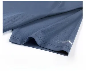 Detail of blue mesh quick-dry fabric sleeve with reflective strip and twin-needle stitching