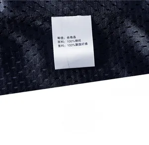 Close-up of wash label and breathable mesh lining of the outdoor waterproof jacket