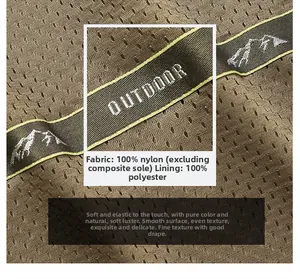 Detail of breathable brown mesh fabric and outdoor woven strap with mountain logo