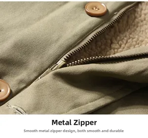 Detail of a smooth metal zipper and thick faux shearling lining on a military green jacket