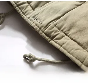 Detail shot of khaki N1 deck jacket hem with precise stitching and drawstring
