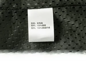 Detail view of the breathable mesh lining and washing label of the nylon outdoor vest