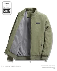 Detail of green corduroy jacket with zipper closure and black-white striped lining