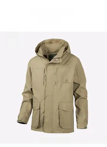 Detail of khaki outdoor jacket showing the adjustable hood and functional multi-pocket design