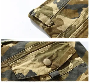 Detailed macro view of camo cargo shorts showing reinforced belt loops and back pocket flap