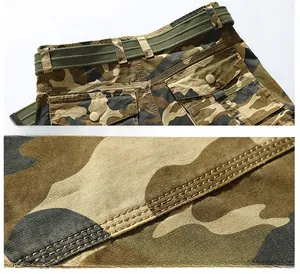 Detail of cargo shorts waist with canvas belt and reinforced stitching on camo fabric