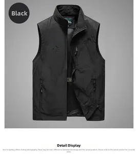 Close-up of black outdoor vest showing zipper pockets, mesh lining, and outdoor logo detail