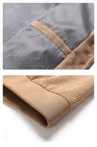 Detail of corduroy jacket showing zippered inner pocket and striped lining with ribbed hem