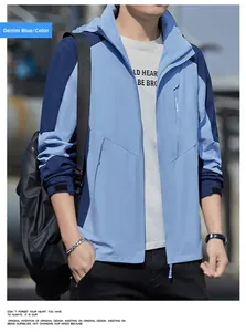 Detail of denim blue outdoor windbreaker jacket featuring a sport logo and zipper pocket