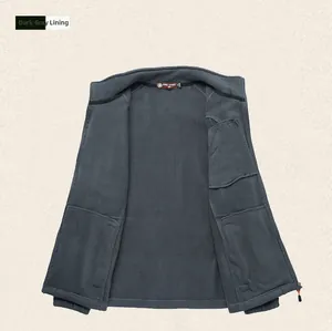 Close-up of warm dark grey polar fleece lining with internal pocket and zipper detail