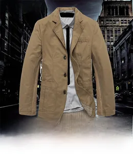 Detail view showing the khaki cotton blazer's large patch pockets and striped lining