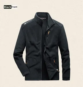 Close-up of black fleece jacket featuring a stand collar and orange zipper pockets