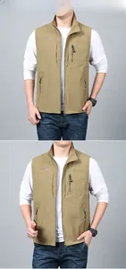 Detail of khaki outdoor vest showing embroidery and multi-pocket zipper design