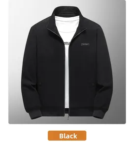Close-up of black corduroy jacket with stand collar and decorative chest letter patch