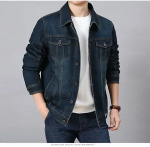 Close-up of deep blue denim jacket featuring classic collar and functional flap pockets