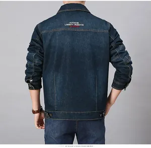 Detail of outdoor liberty freedom fashion embroidery on back of blue denim jacket