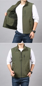 Close-up of olive green fishing vest showing breathable black mesh lining and zip pockets