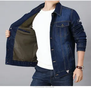 Detailed view of dark blue denim jacket featuring a brown honeycomb mesh lining and metal buttons